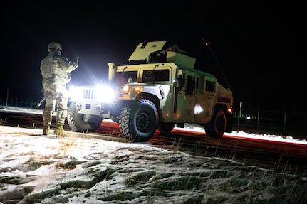 Soldiers from 113th Military Police Company, Mississippi Army National Guard, patrol the missile defense complex as part of exercise Guardian Watch 23 at Fort Greely, Alaska, Nov. 2, 2022. Guardian Watch 23 focused on ground-based midcourse defense and critical installations security, which are the two missions of the 49th Missile Defense Battalion.