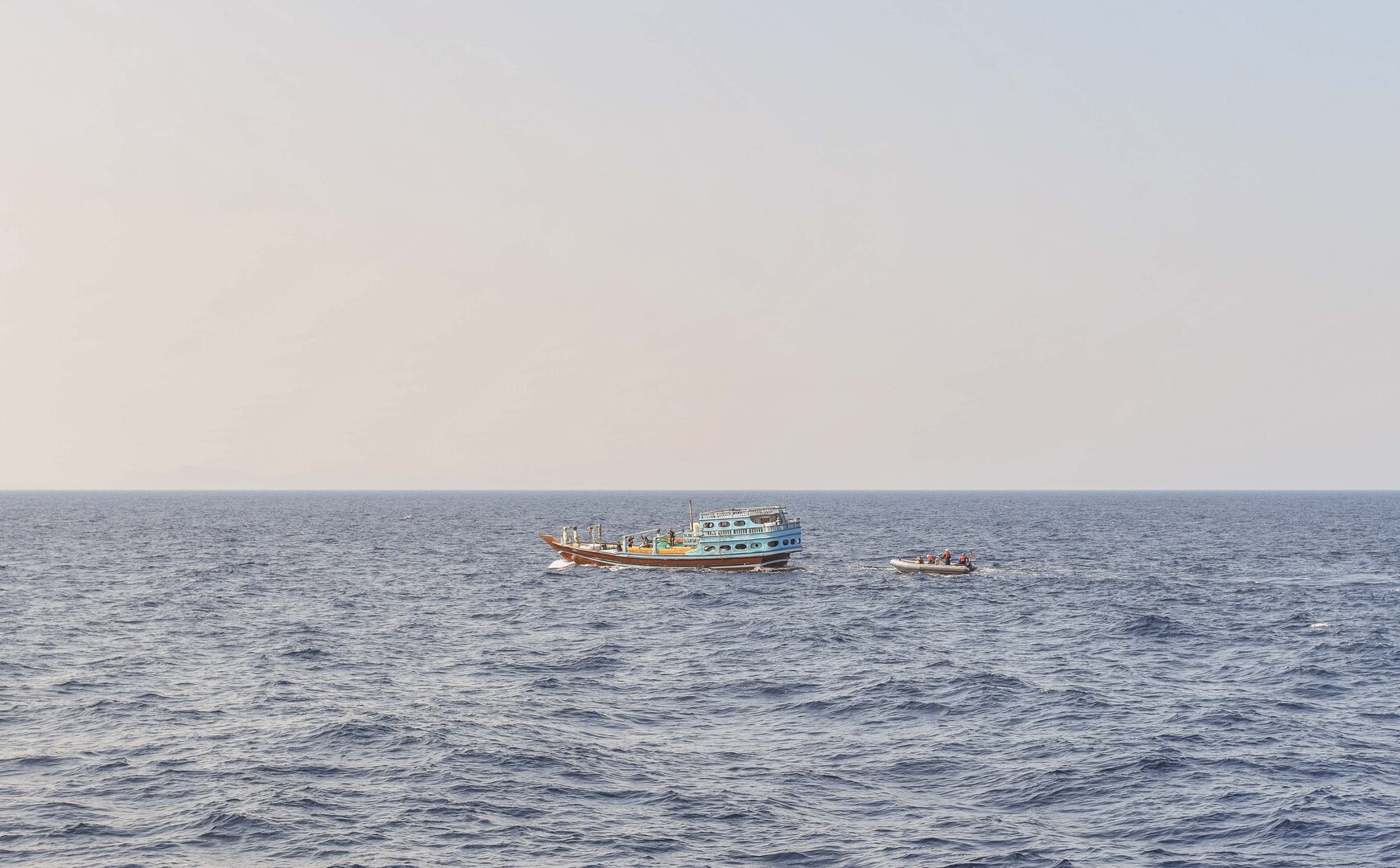 GULF OF OMAN (Nov. 8, 2022) U.S. naval forces approach a fishing vessel transiting international waters in the Gulf of Oman, Nov. 8, during an interdiction.