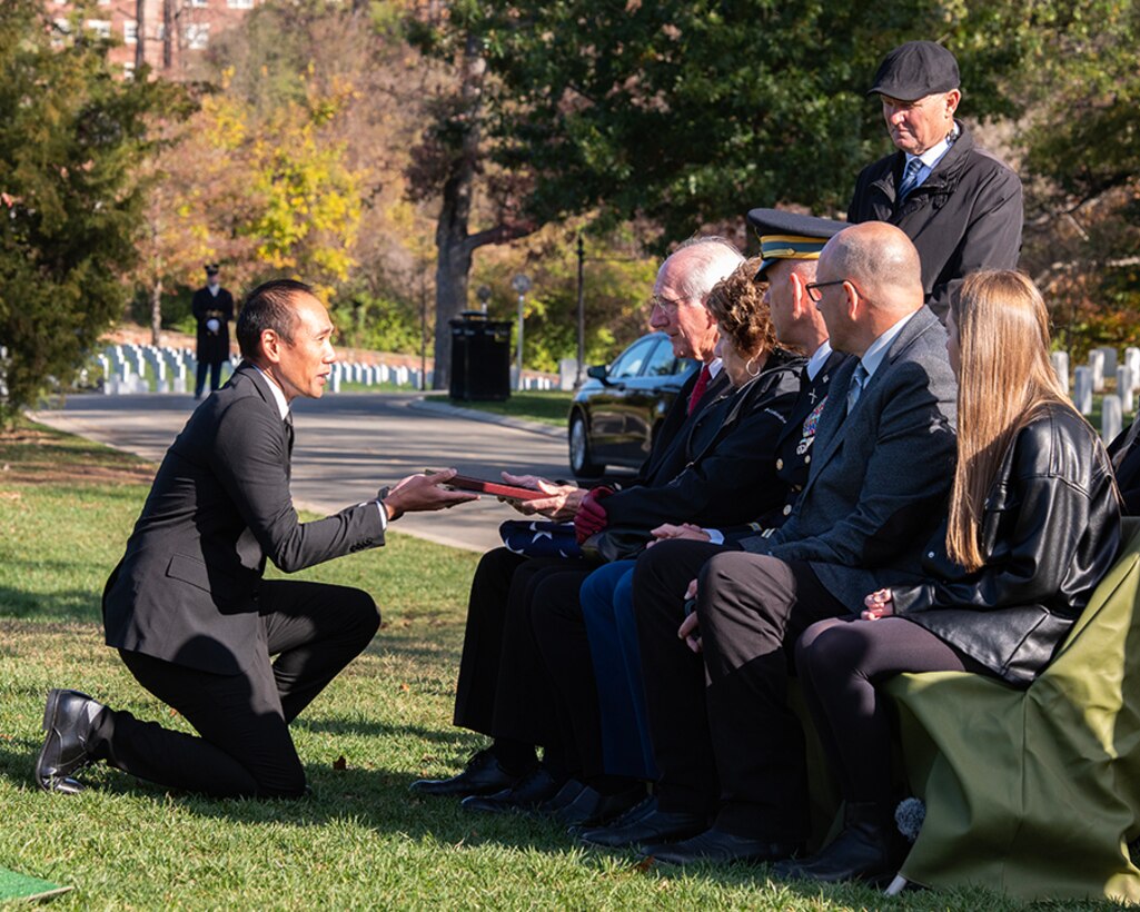 Defense POW/MIA Accounting Agency, Director of Outreach and Communication, Mr. Mark Abueg speaks with the family of Army Private First Class Robert L. Alexander during his full military honors funeral, in Arlington National Cemetery, Arlington, Va., Nov. 14, 2022.

Alexander was killed during World War II and was accounted for on June 21, 2022.

In July 1944, Alexander was a member of the 105th Infantry Regiment, 27th Infantry Division, fighting the Japanese on Saipan in the Mariana Islands. Alexander was killed July 7 when the Japanese general on Saipan ordered his forces into a mass suicide, or “banzai,” attack against the 105th's lines.

Following the end of the war, the American Graves Registration Service (AGRS) was tasked with investigating and recovering missing American personnel in the Pacific Theater. They searched for and disinterred remains on Saipan, but could not identify any as Alexander. He was declared non-recoverable in September 1949.

Remains, designated as Unknown X-27 27th Infantry Division Cemetery, were recovered from Saipan and interred in the Fort William McKinley Cemetery, now the Manila American Cemetery and Memorial, an American Battle Monuments Commission site in the Philippines.

After thorough historical research, it was determined that X-27 could likely be identified. On Jan. 22, 2019, Unknown X-27 was disinterred and sent to the DPAA Laboratory at Joint Base Pearl Harbor-Hickam, Hawaii, for analysis.

Alexander’s name is recorded in the Courts of the Missing at the National Memorial Cemetery of the Pacific in Honolulu, along with the others who are still missing from World War II. A rosette will be placed next to his name to indicate he has been accounted for.