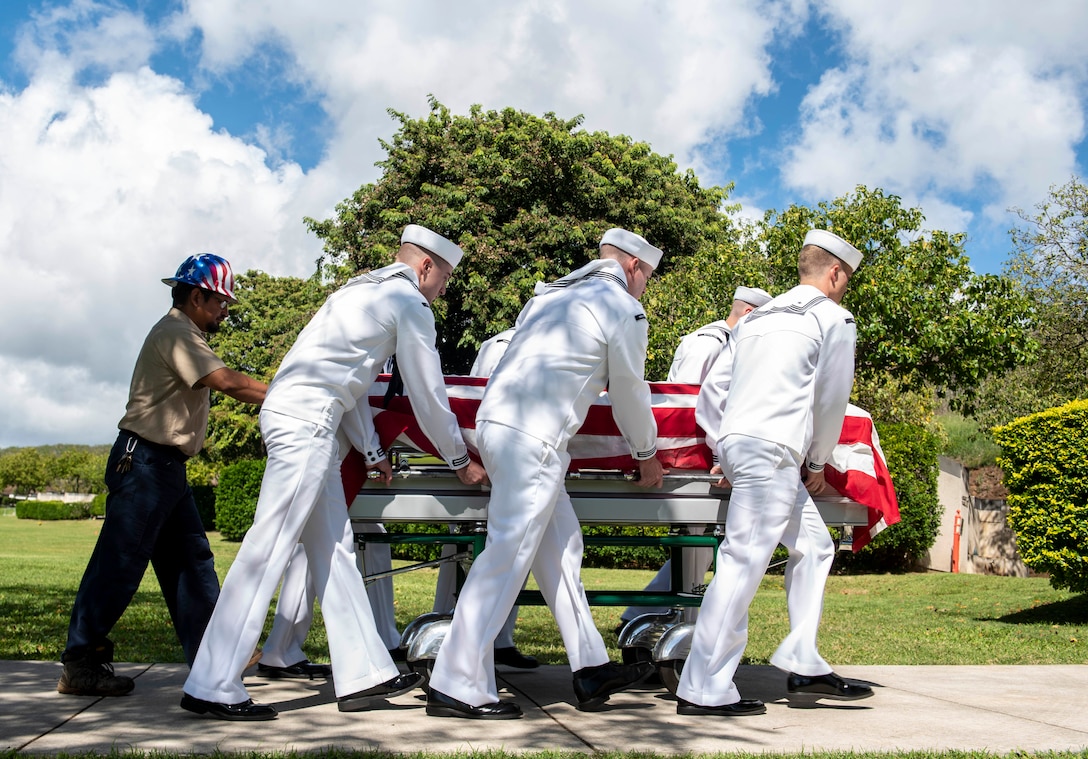 U.S. Navy Sailors assigned to Navy Region Hawaii and the Defense POW/MIA Accounting Agency (DPAA) conduct an interment ceremony at the National Memorial Cemetery of the Pacific, Honolulu, Hawaii, Nov. 9, 2022. Members of DPAA and attending family members paid their respects and honored the life of U.S. Navy Fireman 3rd Class Clarence A. Blaylock, who was assigned to the USS Oklahoma when the ship was attacked by Japanese aircraft during World War II. Blaylock was accounted for on July 29, 2019, nearly 80 years after the attacks on Pearl Harbor. (U.S. Air Force photo by Staff Sgt. Jonathan McElderry)