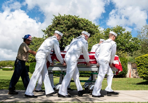 U.S. Navy Sailors assigned to Navy Region Hawaii and the Defense POW/MIA Accounting Agency (DPAA) conduct an interment ceremony at the National Memorial Cemetery of the Pacific, Honolulu, Hawaii, Nov. 9, 2022. Members of DPAA and attending family members paid their respects and honored the life of U.S. Navy Fireman 3rd Class Clarence A. Blaylock, who was assigned to the USS Oklahoma when the ship was attacked by Japanese aircraft during World War II. Blaylock was accounted for on July 29, 2019, nearly 80 years after the attacks on Pearl Harbor. (U.S. Air Force photo by Staff Sgt. Jonathan McElderry)