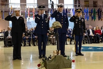 A Joint Forces Honor Guard renders final honors during a Fallen Warrior Ceremony for the  Department of Military and Veterans Affairs Veterans Day ceremony held at the National Guard Armory on Joint Base Elmendorf-Richardson, Alaska, Nov. 11, 2022. The ceremony included speeches from key speakers, Fallen Warrior ceremony, presentation of commemorative wreaths, and moment of silence for those who have fallen. (Alaska National Guard photo by Victoria Granado)