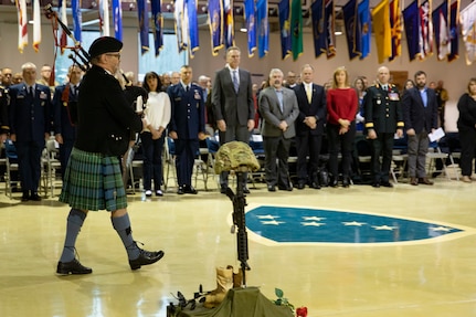 Ian White plays Amazing Grace on the bagpipes to honor the fallen during the Department of Military and Veterans Affairs Veterans Day ceremony held at the National Guard Armory on Joint Base Elmendorf-Richardson, Alaska, Nov. 11, 2022. The ceremony included speeches from key speakers, Fallen Warrior ceremony, presentation of commemorative wreaths, and moment of silence for those who have fallen. (Alaska National Guard photo by Victoria Granado)