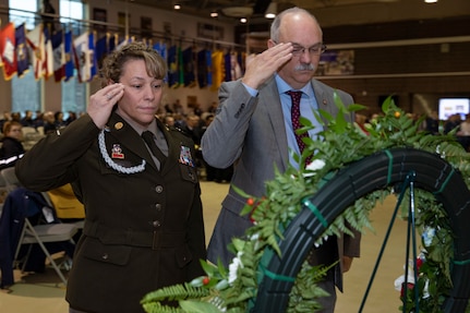 Command Sgt. Maj. Julie Small, command senior enlisted leader of the Alaska National Guard, left, and Verdie Bowen, director of the Office of Veterans Affairs, render a salute to a commemorative wreath to honor veterans during the Department of Military and Veterans Affairs Veterans Day ceremony held at the National Guard Armory on Joint Base Elmendorf-Richardson, Alaska, Nov. 11, 2022. The ceremony included speeches from key speakers, Fallen Warrior ceremony, presentation of commemorative wreaths, and moment of silence for those who have fallen. (Alaska National Guard photo by Victoria Granado)