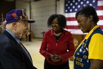 Gordon Severson, a Korean War veteran, left, talks with Dawn Bundick, president, right, and Carolyn Kearney-Corey, senior vice president, both with the Jon Art Noyes Veterans of Foreign Wars Post 9978, after the conclusion of the Department of Military and Veterans Affairs Veterans Day ceremony held at the National Guard Armory on Joint Base Elmendorf-Richardson, Alaska, Nov. 11, 2022. The ceremony included speeches from key speakers, Fallen Warrior ceremony, presentation of commemorative wreaths, and moment of silence for those who have fallen. (Alaska National Guard photo by Victoria Granado)