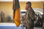 A guidon bearer from the Wisconsin Army National Guard's 157th Maneuver Enhancement Brigade holds the unit's colors during a transfer of authority ceremony at Camp Lemonnier, Djibouti, Nov. 5, 2022.