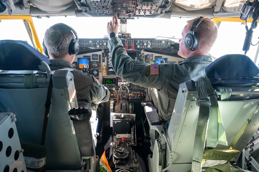 Under the direction of the North American Aerospace Defense Command (NORAD), Lt. Col. Ian Hurbanek, left, and Lt. Col. Brian Radford, right, beings pre-flight checks on a KC-135 during air-defense Operation NOBLE DEFENDER, Oct. 27, 2022.