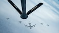 Under the direction of the North American Aerospace Defense Command (NORAD), F-15s assigned to the Massachusetts Air National Guard, CF-18s assigned to the Royal Canadian Air Force, and a KC-135 assigned to the Main Air National Guard fly in formation behind a KC-135 assigned to the Pennsylvania Air National Guard during air-defense Operation NOBLE DEFENDER, Oct. 27, 2022.