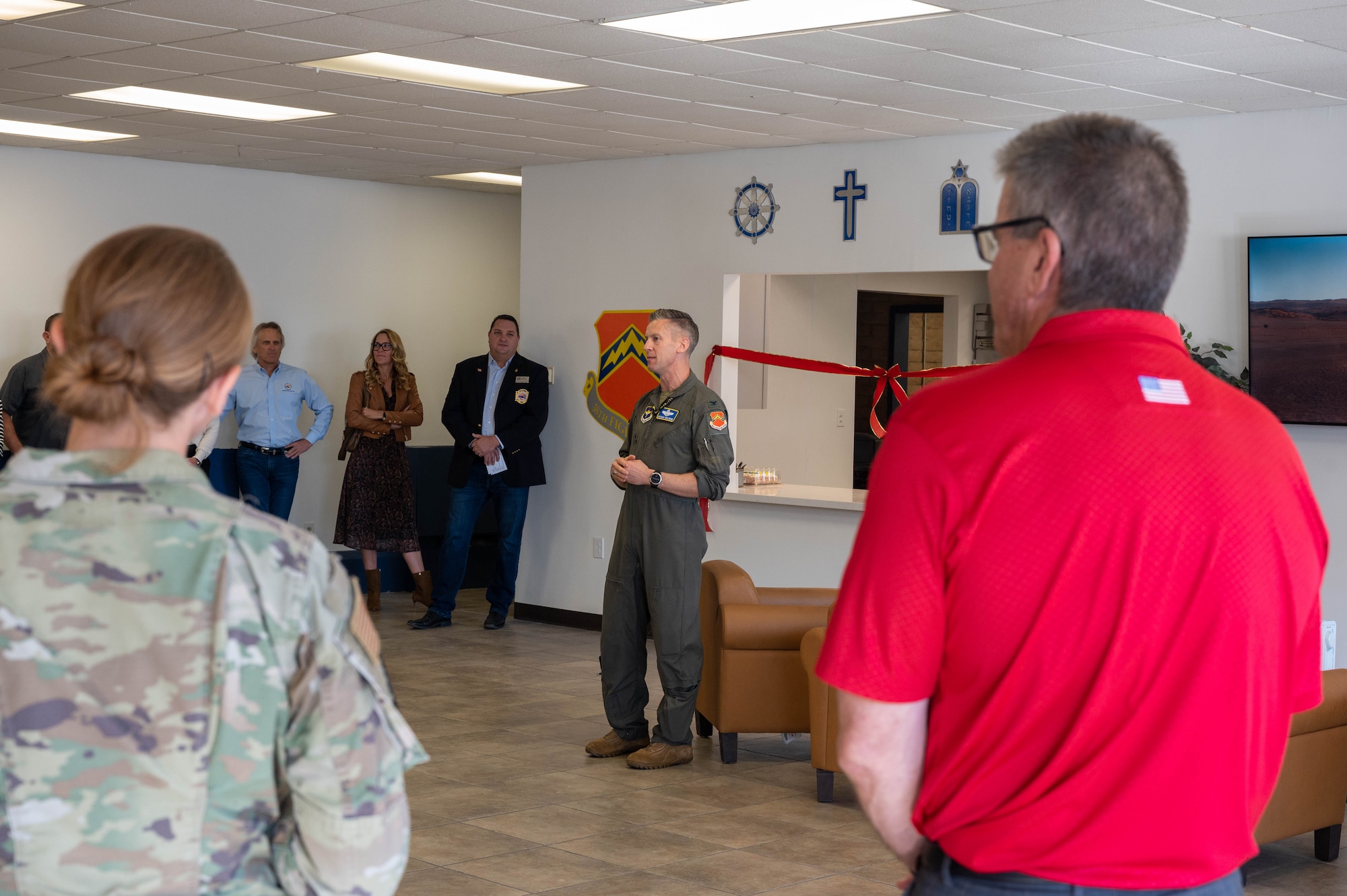 U.S. Air Force Col. Keagan McLeese, 56th Fighter Wing vice commander, speaks to 56th FW Airmen and community members during the chapel kitchen ribbon-cutting ceremony Nov. 8, 2022, at Luke Air Force Base, Arizona.