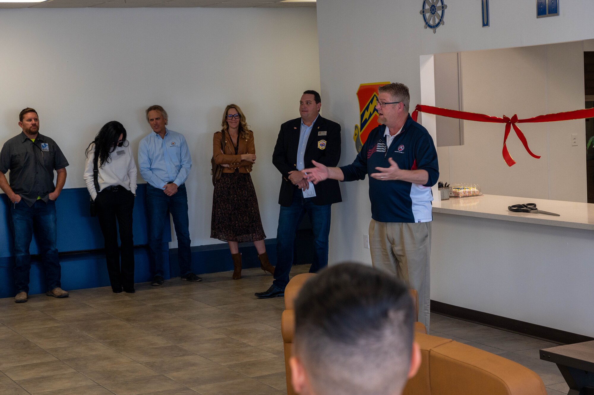 Ron Sites, Fighter Country Foundation president, speaks to 56th Fighter Wing Airmen and community members  during the chapel kitchen ribbon-cutting ceremony Nov. 8, 2022, at Luke Air Force Base, Arizona.