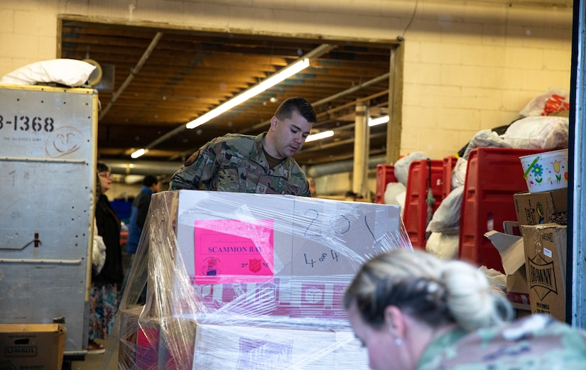 Tech. Sgt. Michael Durgin, a ground transportation specialist with 176th Logistics Readiness Squadron, 176th Wing guides a pallet of gifts for Operation Santa Claus onto a truck at the Salvation Army warehouse in Anchorage, Alaska, Nov. 10, 2022. Operation Santa Claus is the AKNG’s yearly community relations and support program that provides gifts to children in remote communities across the state. In its 67th year, the program will celebrate with the communities of Scammon Bay, Minto and Nuiqsuit. (Alaska National Guard photo by Staff Sgt. Katie Mazos-Vega)