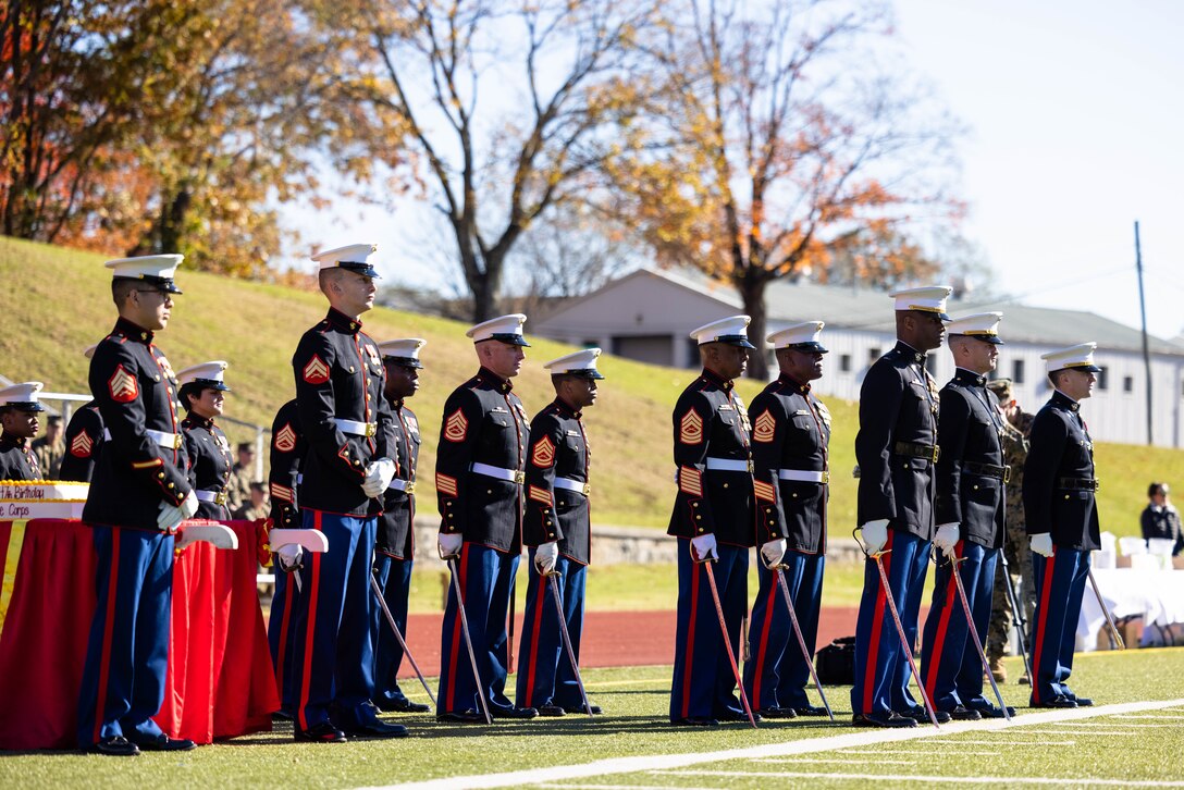 U.S. Marines with Marine Corps Base Quantico sword detail stand in formation during MCBQ’s cake cutting ceremony at Butler Stadium in honor of the 247th Marine Corps Birthday on MCBQ, Virginia, Nov. 9, 2022.  The annual cake cutting ceremony is a long-standing tradition which celebrates the establishment of the United States Marine Corps. The Marine Corps birthday is celebrated every year to commemorate the birth of the Corps and honor the service and sacrifices of all Marines, past and present. (U.S. Marine Corps photo by Cpl. Eric Huynh)