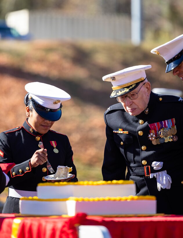 U.S. Marine Corps Pfc. Maria C. Lopez, an administrative specialist with Security Battalion, receives a piece of cake as the youngest Marine in attendance during MCBQ’s cake cutting ceremony in honor of the 247th Marine Corps Birthday at Butler Stadium on MCBQ, Virginia, Nov. 9, 2022. The annual cake cutting ceremony is a long-standing tradition which celebrates the establishment of the United States Marine Corps. The Marine Corps birthday is celebrated every year to commemorate the birth of the Corps and honor the service and sacrifices of all Marines, past and present. (U.S. Marine Corps photo by Cpl. Eric Huynh)