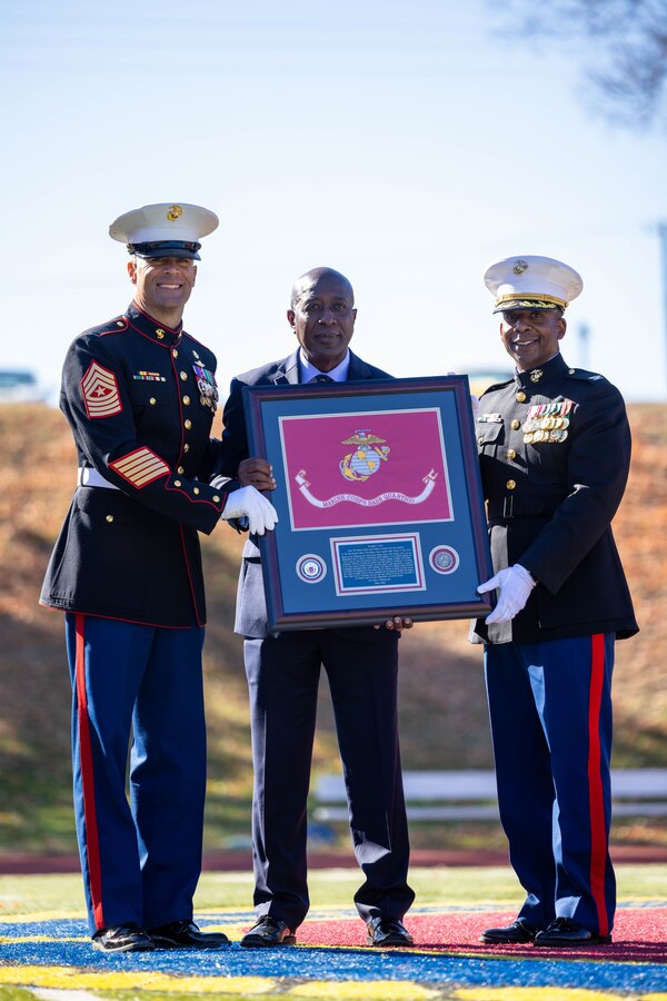 U.S. Marine Corps Sgt. Maj. Collin D. Barry, sergeant major, Marine Corps Base Quantico, left, retired Sgt. Maj. Carlton W. Kent, 16th Sergeant Major of the Marine Corps and guest of honor, center, and Col. Michael L. Brooks, base commander, Marine Corps Base Quantico, pose for a photo during MCBQ’s cake cutting ceremony in honor of the 247th Marine Corps Birthday at Butler Stadium on MCBQ, Virginia, Nov. 9, 2022. The annual cake cutting ceremony is a long-standing tradition which celebrates the establishment of the United States Marine Corps. The Marine Corps birthday is celebrated every year to commemorate the birth of the Corps and honor the service and sacrifices of all Marines, past and present. (U.S. Marine Corps photo by Cpl. Eric Huynh)