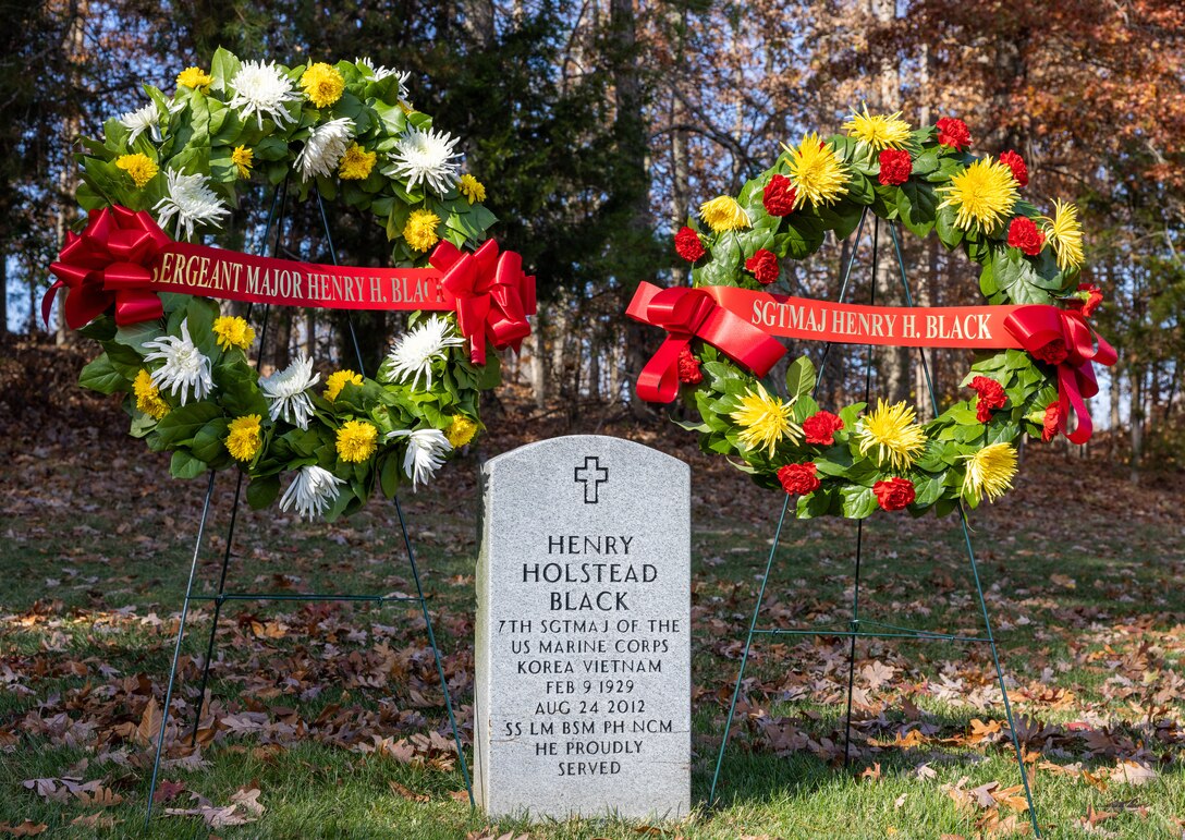 Wreaths are placed by the headstone of Sgt. Maj. Henry Black, 7th Sergeant Major of the Marine Corps, during a wreath laying ceremony at the Quantico National Cemetery, Triangle, Virginia, Nov. 10, 2022. The ceremony is held annually on the Marine Corps birthday to honor the memory and military service of Sgt. Maj. Black. (U.S. Marine Corps Photo by Lance Cpl. Kayla LeClaire)