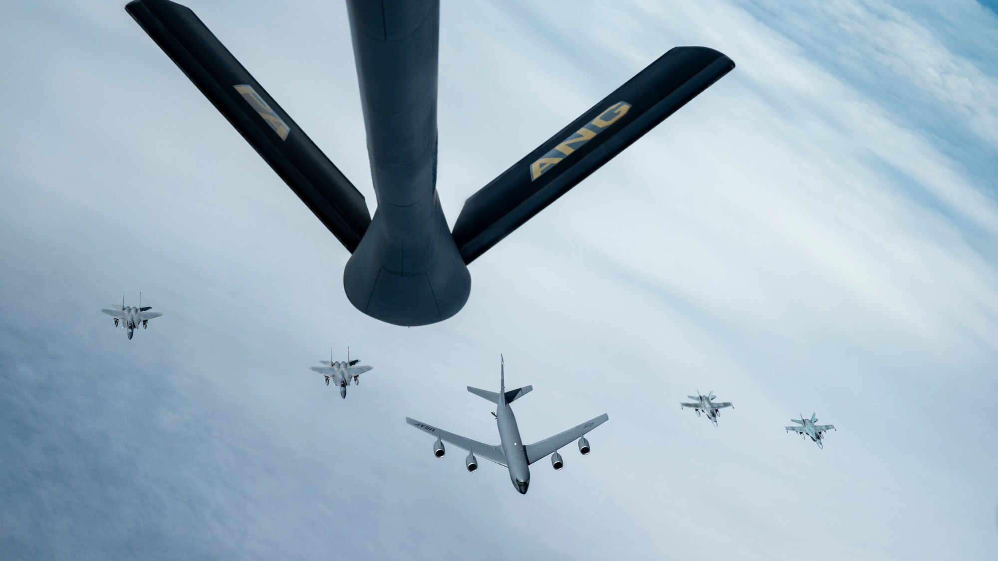 Under the direction of the North American Aerospace Defense Command , F-15s assigned to the Massachusetts Air National Guard, CF-18s assigned to the Royal Canadian Air Force, and a KC-135 assigned to the Maine Air National Guard fly in formation behind a KC-135 assigned to the Pennsylvania Air National Guard during air defense Operation Noble Defender Oct. 27, 2022.  The exercise validates the command’s capability to defend Canada and the United States.