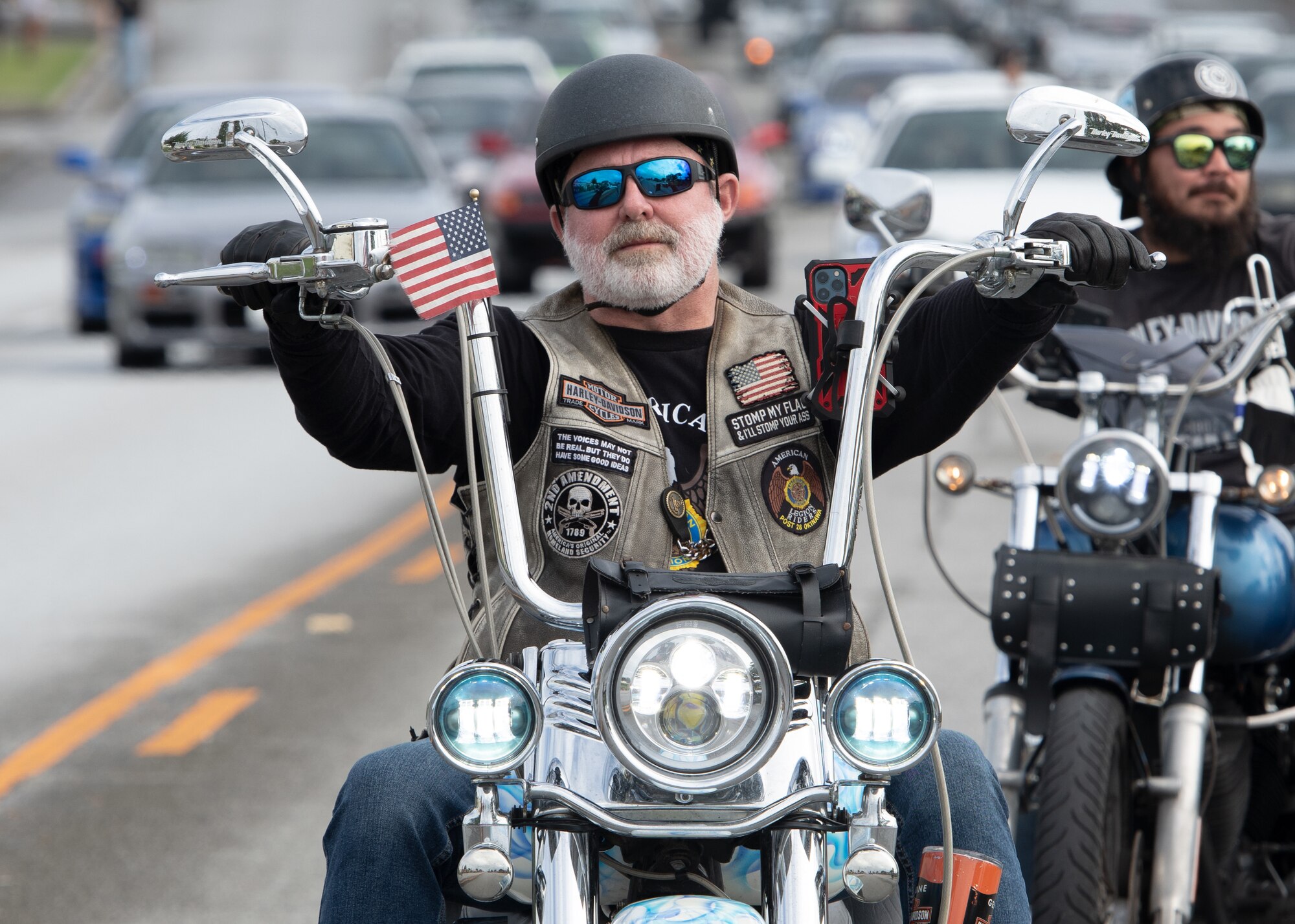 parade participant rides motorcycle