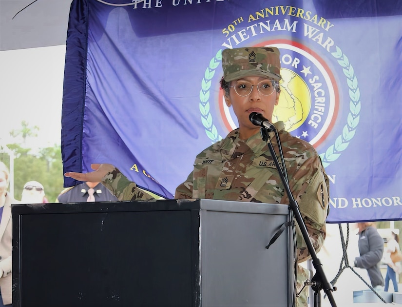 Master Sgt. Kisha S. White, military equal opportunity advisor, 75th Innovation Command, U.S. Army Reserve, addresses more than 800 veterans, families, volunteers, and special guests during the closing ceremony of the Wall That Heals - Chambers County exhibit Oct. 30, 2022, in Anahuac, Texas. White, a 29-year Army veteran, was invited by the Vietnam War Memorial Fund to serve as keynote speaker for this event that attracted more than 4,500 visitors over the course of four days. White recognized the 58,281 men and women who made the ultimate sacrifice in Vietnam while thanking veterans from that war for their courage and dedication despite the negative reception many received upon their return to the U.S. (photo courtesy of Wall That Heals - Chambers County)
