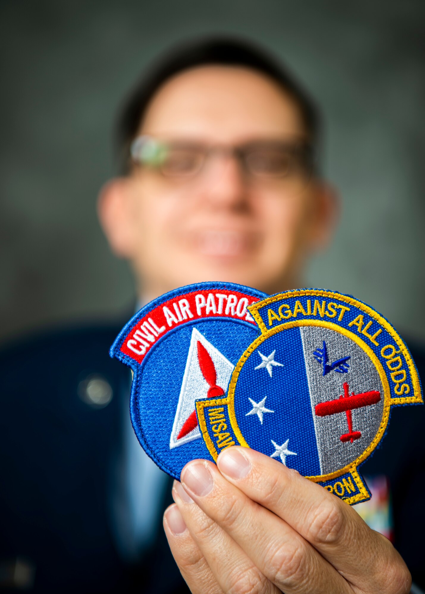 U.S. Air Force Tech. Sgt. Jeffrey MacHott, Civil Air Patrol (CAP) member, poses for photos at Misawa Air Base, Japan, Nov. 15, 2022. MacHott joined the CAP Geospatial Team that allows individuals to remotely provide damage assessment services for emergency management agencies.