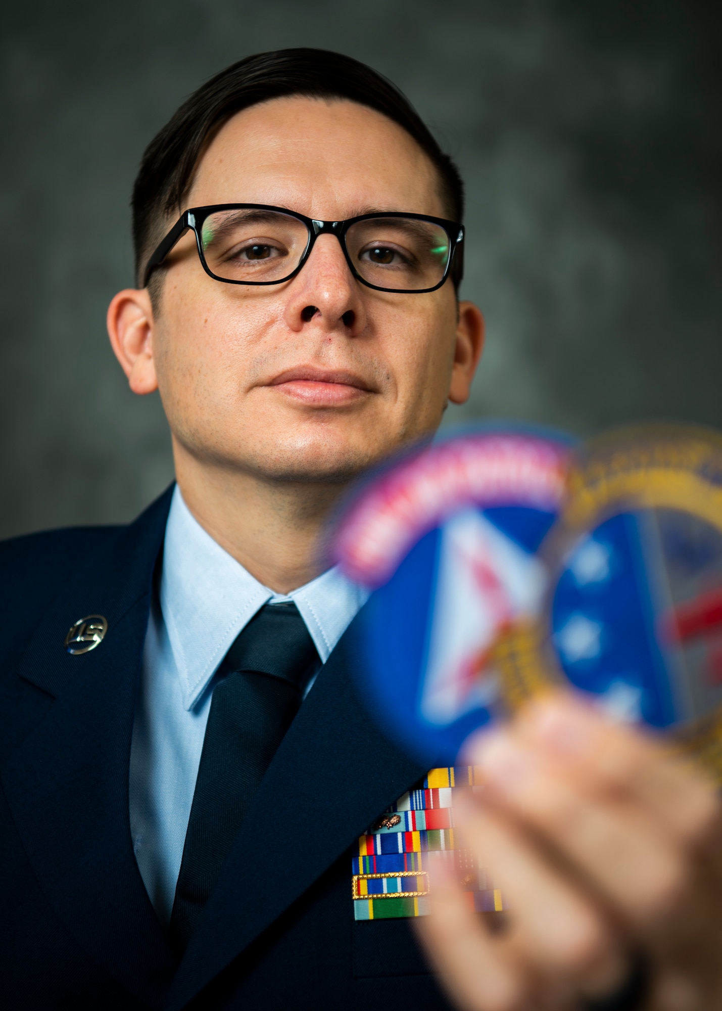 U.S. Air Force Tech. Sgt. Jeffrey MacHott, Civil Air Patrol (CAP) member, poses for photos at Misawa Air Base, Japan, Nov. 15, 2022. MacHott joined the CAP Geospatial Team that allows individuals to remotely provide damage assessment services for emergency management agencies.