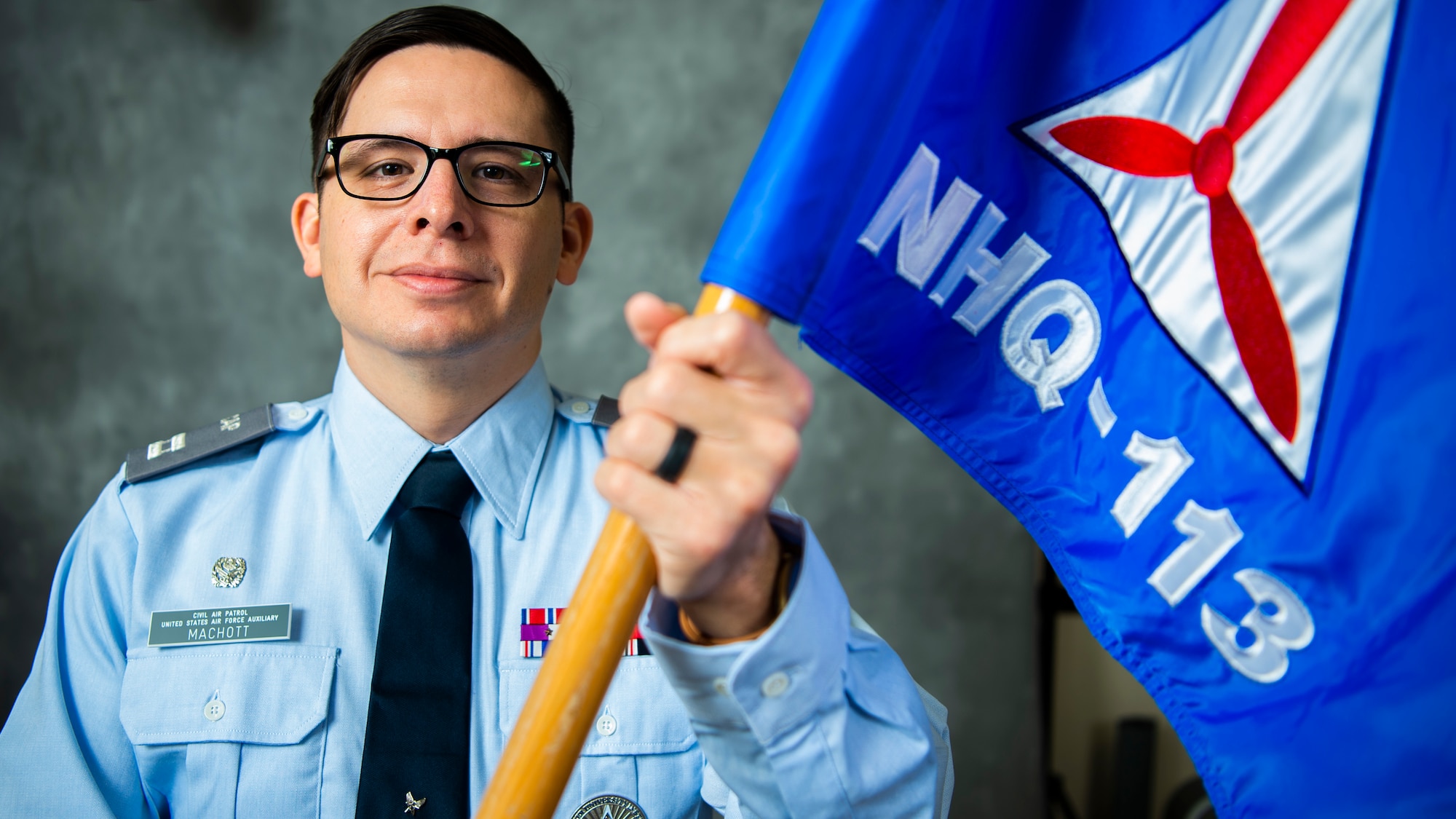 U.S. Air Force Tech. Sgt. Jeffrey MacHott, Civil Air Patrol (CAP) member, poses for photos at Misawa Air Base, Japan, Nov. 15, 2022. MacHott joined the CAP Geospatial Team that allows individuals to remotely provide damage assessment services for emergency management agencies.