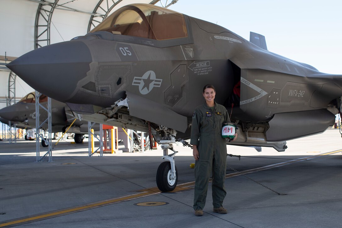U.S. Marine Corps Sgt. Brooke Thompson, an avionics technician with Marine Fighter Attack Squadron (VMFA) 242, poses for a photo in front of an F-35B Lightning II aircraft at Marine Corps Air Station (MCAS), Iwakuni, Japan, Oct. 20,2022. Thompson was awarded the U.S. Navy and Marine Corps Commendation medal for her meritorious service since her arrival to MCAS Iwakuni  in 2018, where she held multiple billets, and supported multiple exercises and operations across the Indo-Pacific. (U.S. Marine Corps photo by Lance Cpl. Samantha Rodriguez)