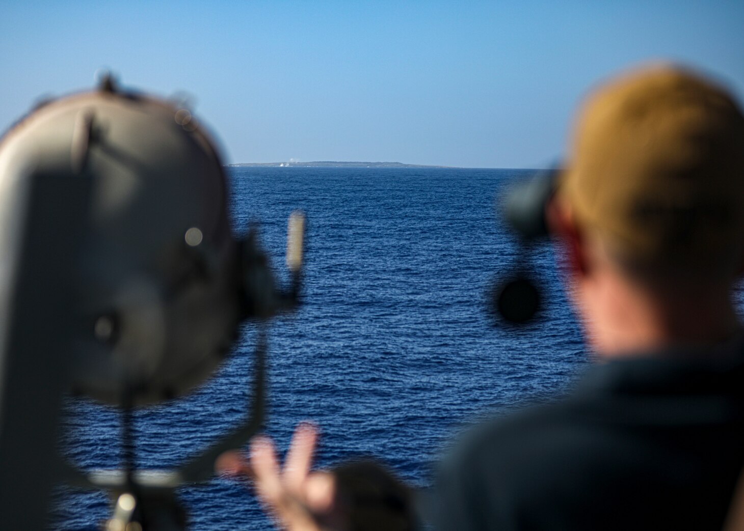 PHILIPPINE SEA (Nov. 13, 2022) Cmdr. Marcus Seeger, commanding officer of Arleigh Burke-class guided-missile destroyer USS Benfold (DDG 65), monitors a 5-inch live-fire gunnery exercise, part of Keen Sword in the Philippine Sea, Nov. 13. Keen Sword is a biennial, joint and bilateral field-training exercise involving U.S. military and Japan Self-Defense Force personnel, designed to increase readiness and interoperability while strengthening the ironclad Japan-U.S. alliance. (U.S. Navy photo by Mass Communication Specialist 2nd Class Arthur Rosen)