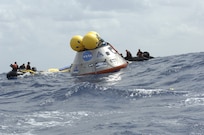 A mock-up of the Orion crew exploration vehicle floats in the open waters of the Atlantic Ocean in 2009. NASA engineers are testing this 18,000-pound mock-up, which was built by engineers at Naval Surface Warfare Center, Carderock Division, to learn what the crews will experience after Orion lands and the recovery teams begin their work. Three weeks prior, the mock-up was on display on the National Mall in Washington as it made its way from West Bethesda, Md., to the Kennedy Space Center in Florida. (Image Credit: NASA)