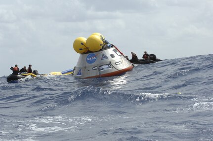 A mock-up of the Orion crew exploration vehicle floats in the open waters of the Atlantic Ocean in 2009. NASA engineers are testing this 18,000-pound mock-up, which was built by engineers at Naval Surface Warfare Center, Carderock Division, to learn what the crews will experience after Orion lands and the recovery teams begin their work. Three weeks prior, the mock-up was on display on the National Mall in Washington as it made its way from West Bethesda, Md., to the Kennedy Space Center in Florida. (Image Credit: NASA)