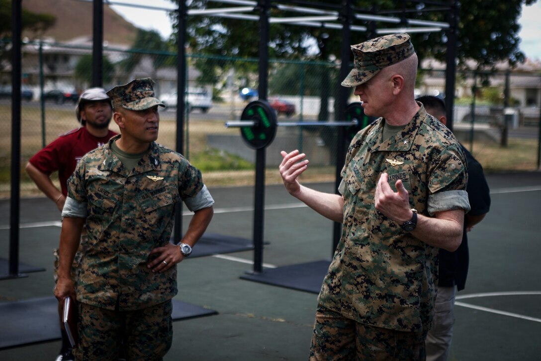 U.S. Marine Corps Brig. Gen. Paul Rock Jr. (right), commanding general, Marine Corps Installations Pacific, speaks with Col. Raul Lianez, commanding officer, Marine Corps Base Hawaii (MCBH), during a tour of the outdoor High Intensity Tactical Training Center aboard MCBH, June 25, 2018. Maj. Gen. Vincent Coglianese, Commander, Marine Corps Installations Command, Assistant Deputy Commandant, Installations and Logistics, is conducting a tour of all of the bases within Marine Corps Installations Pacific to develop more understanding of the issues and circumstances that each base faces. (U.S. Marine Corps photo by Sgt. Aaron Patterson).