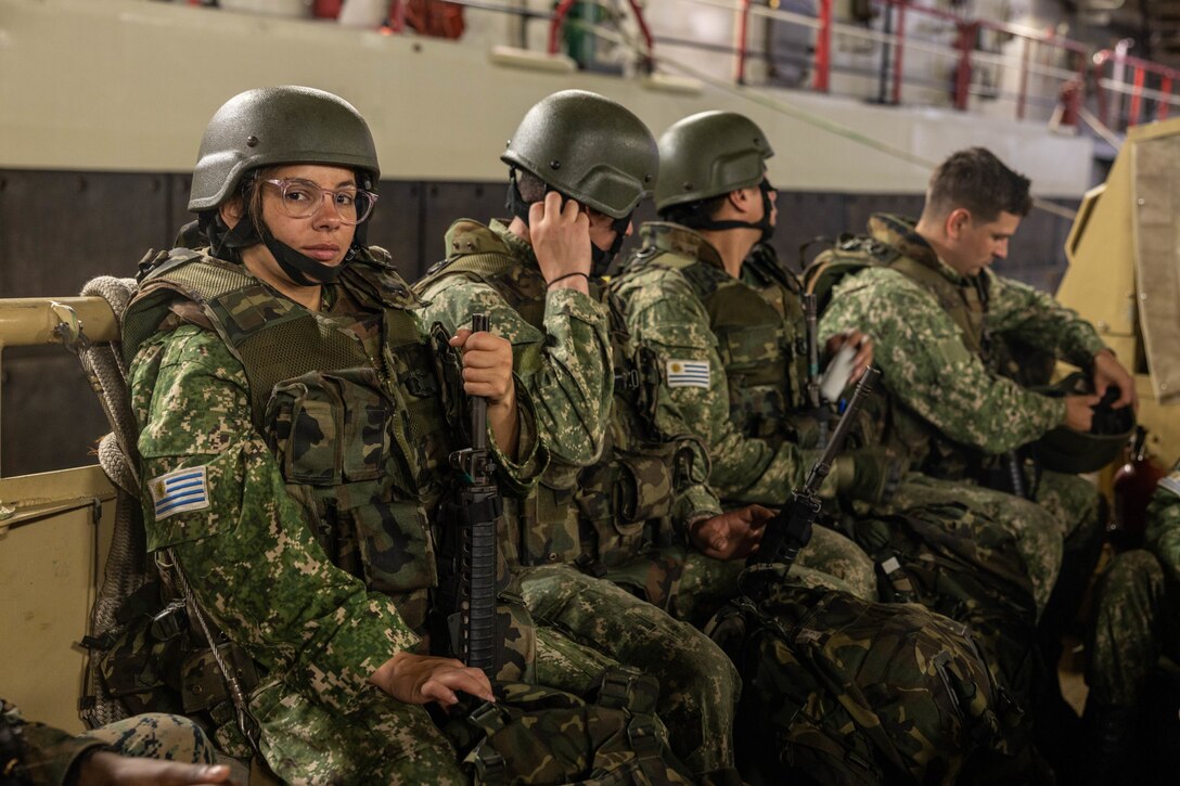Marina Milagros Correa (Private Uruguayan Marine Corps) poses for a photo during exercise UNITAS LXIII aboard the USS Mesa Verde (LPD 19), Sept. 18, 2022. UNITAS, which is Latin for “unity,” was conceived in 1959 and has taken place annually since first conducted in 1960. UNITAS trains forces to conduct joint maritime operations through the execution of anti-surface, anti-submarine, anti-air, amphibious, and electronic warfare operations that enhance warfighting proficiency and increase interoperability among participating navy and marine forces. (U.S. Marine Corps photo by Lance Cpl. David Intriago)