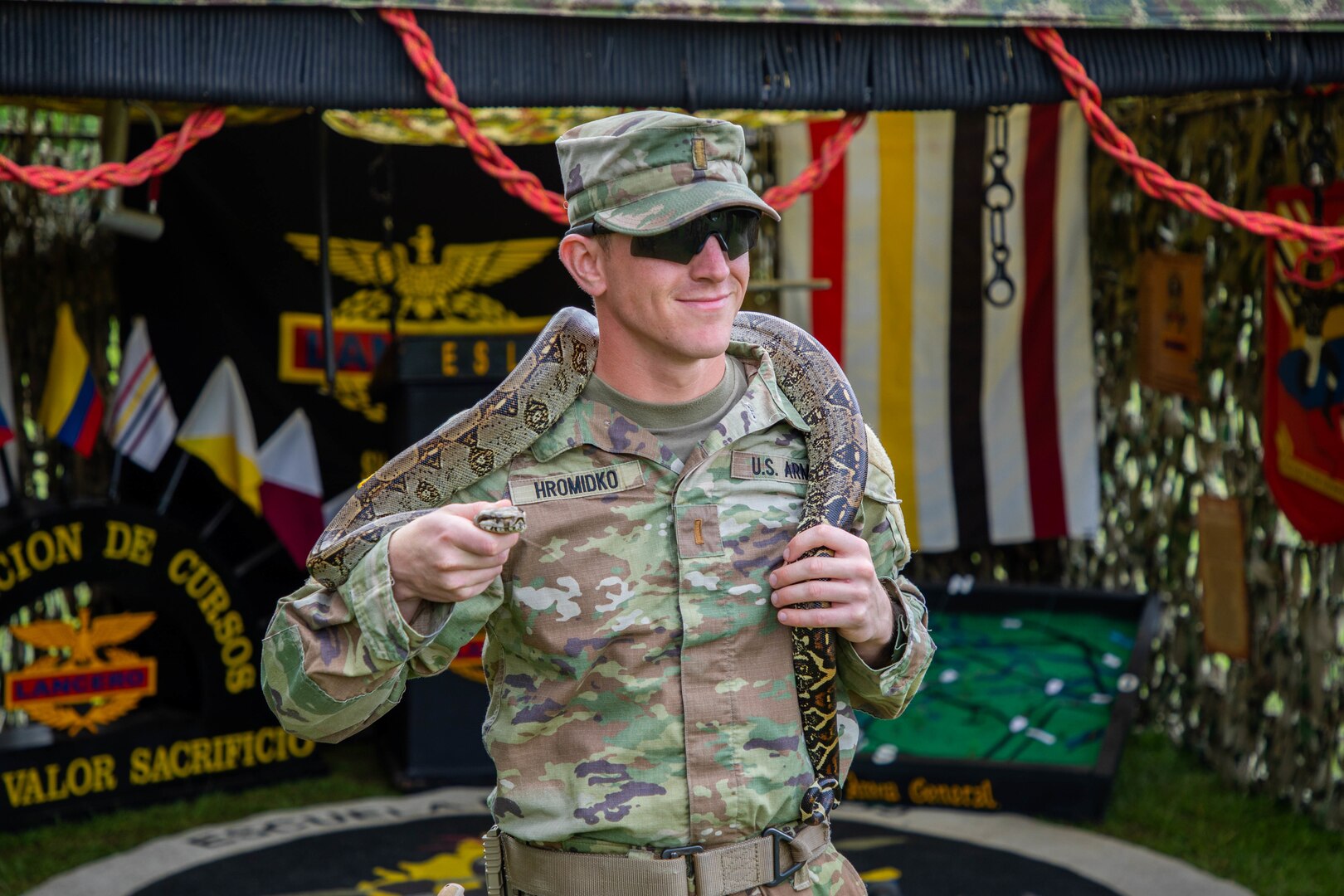 2nd Lt. Nolan Hromidko, of LaCrosse, Wisconsin, assigned to 2nd Battalion, 130th Infantry Regiment, 33rd Infantry Brigade Combat Team, Illinois Army National Guard, holds a snake which represents the Colombian Army's predominance in jungle operations prior to the opening ceremony of Exercise Southern Vanguard 23 on Nov. 8, 2022 at Tolemaida Military Base, Colombia.