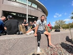 Retired Marine Cpl. Nick Perales, wounded warrior and amputee, rests in front of the Center for the Intrepid