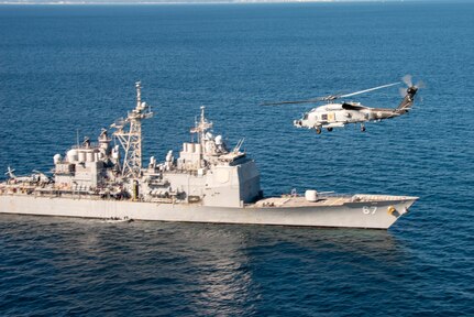 NAVAL AIR FACILITY ATSUGI, Japan (Nov. 16, 2022) An MH-60R Sea Hawk helicopter assigned to the "Warlords" of Helicopter Maritime Strike Squadron FIVE ONE (HSM 51) attached to Naval Air Facility (NAF) Atsugi, conducts passes the Guided-Missle Cruiser USS Shiloh (CG 67) during a flight exercise.