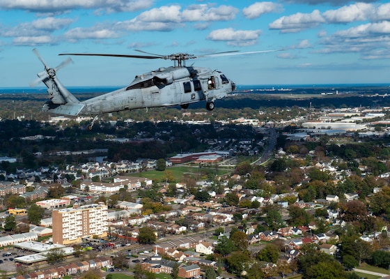 Helicopter flying over city