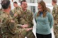 Warrant Officer 2 Creed shares a laugh with his wife and Chief Warrant Officer 5 Kevin Keith after the departure ceremony held at the Army Aviation Support Facility Hanger on Boone National Guard Center Nov. 16, 2022. (U.S. Army National Guard photo by Sgt. 1st Class Benjamin Crane)