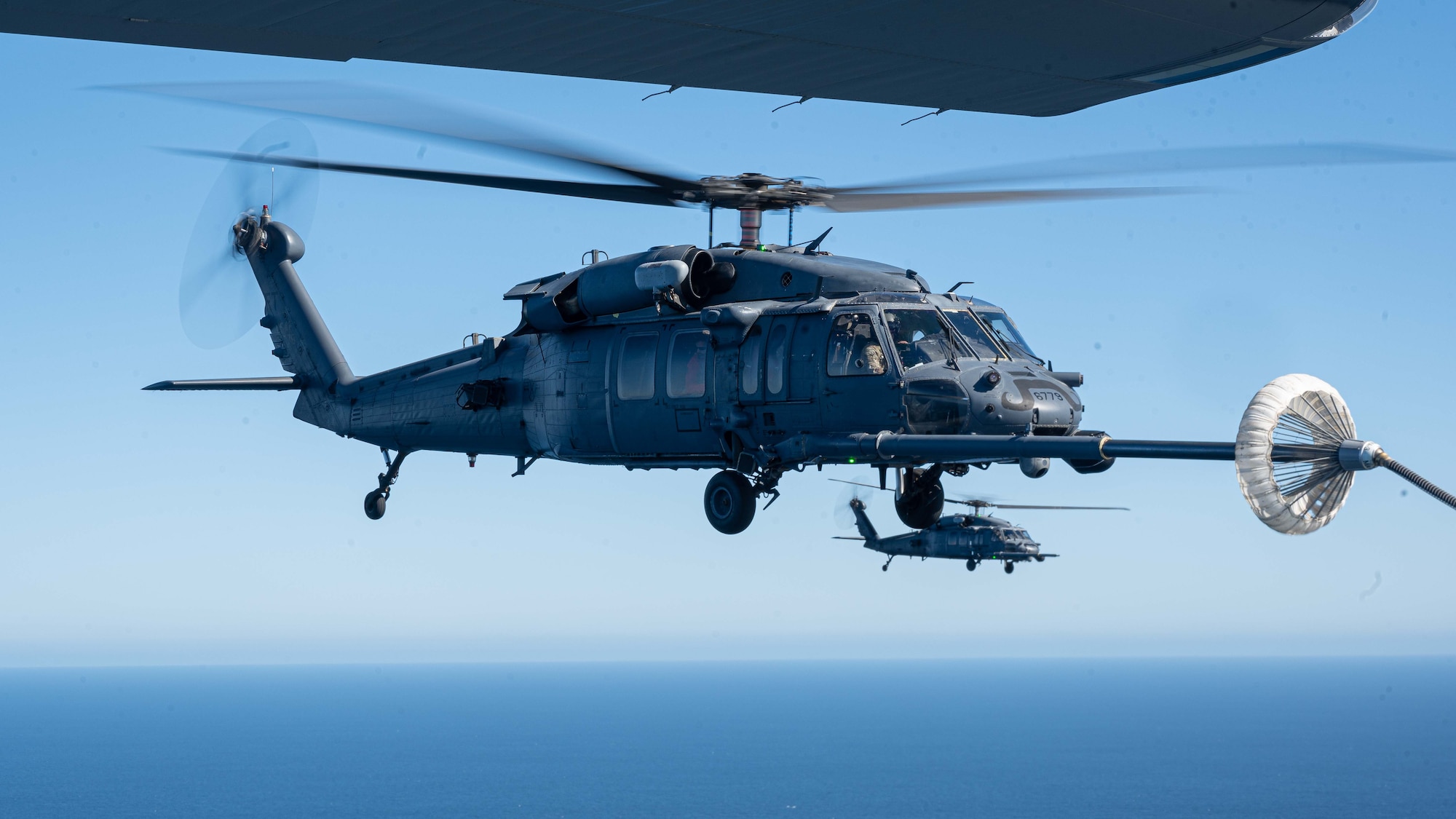 Pictured above is a helicopter refueling mid-air.