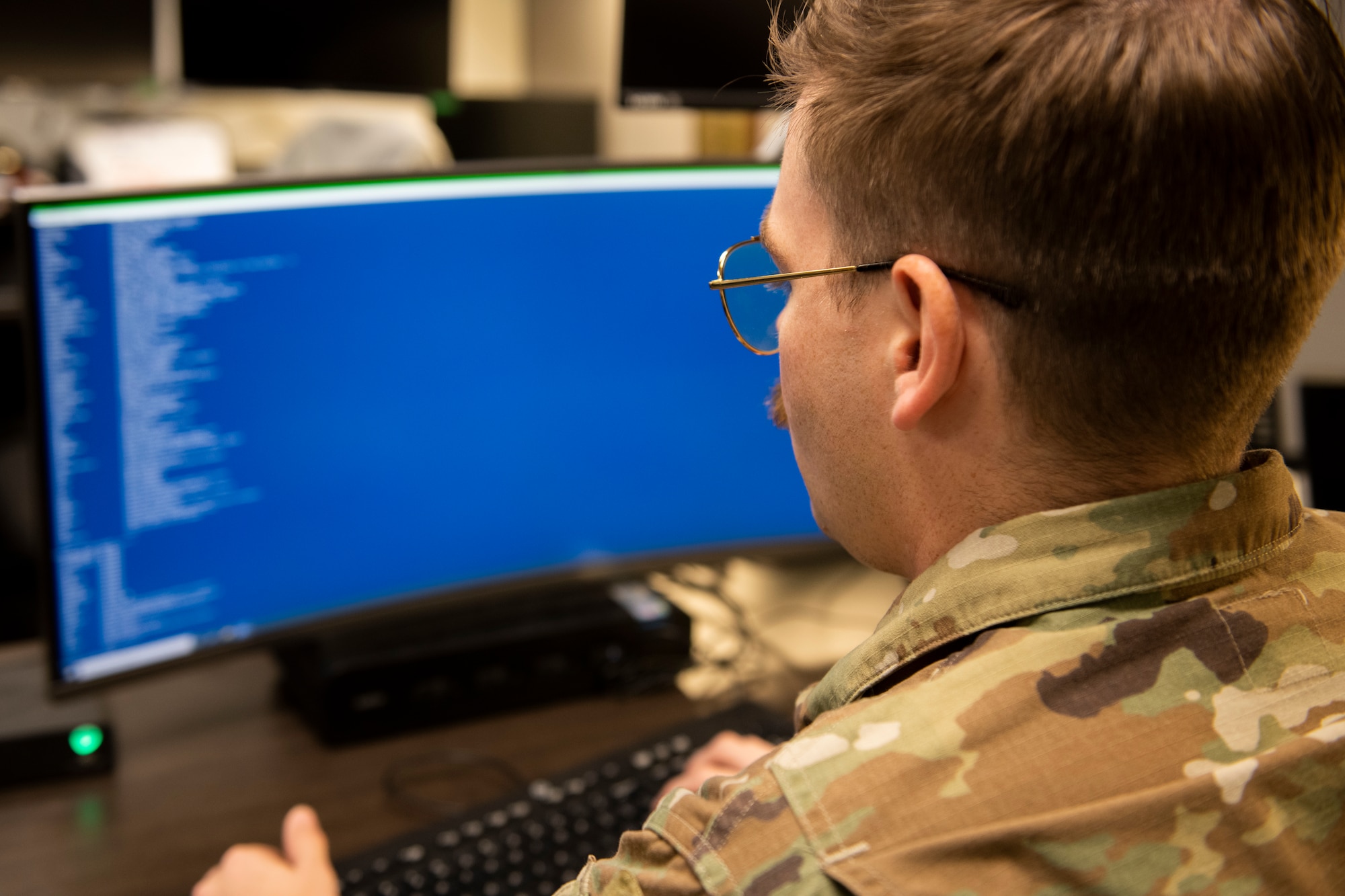 U.S. Air Force Senior Airman Thomas Eldredge, 325th Communications Squadron cyber systems operations journeyman, monitors network systems at Tyndall Air Force Base, Florida, Oct. 27, 2022.