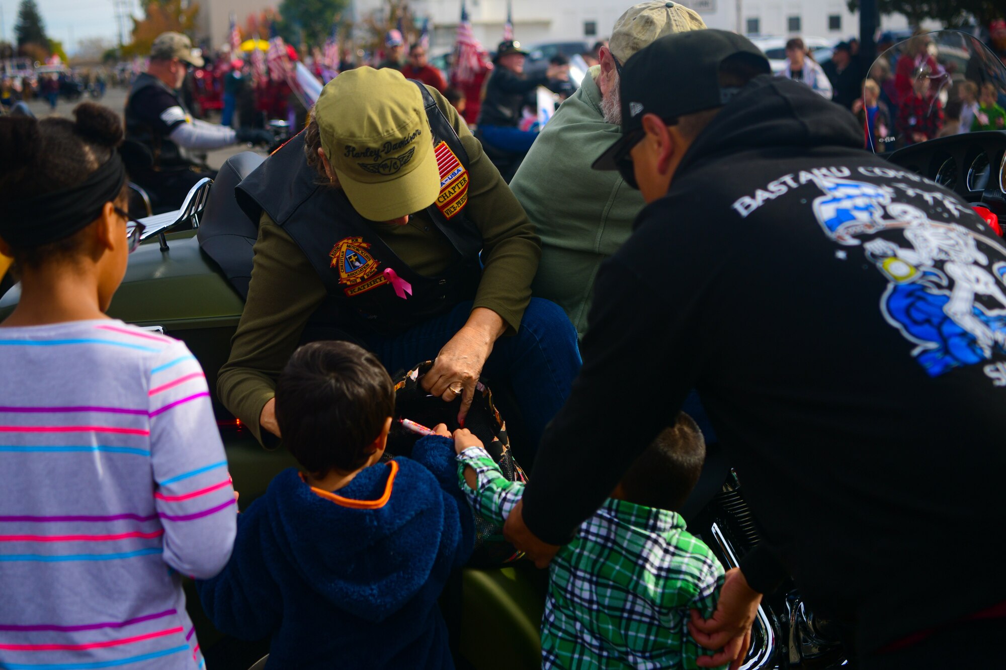Parade participants hand out candy during the Veterans Day parade in Marysville, Calif., on Nov. 11, 2022.