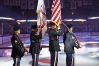 Soldiers assigned to the 85th U.S. Army Reserve Support Command Color guard team present the Colors during the Chicago Wolves-Iowa Wild hockey game at the Allstate Arena in Rosemont, Illinois, November 12, 2022.