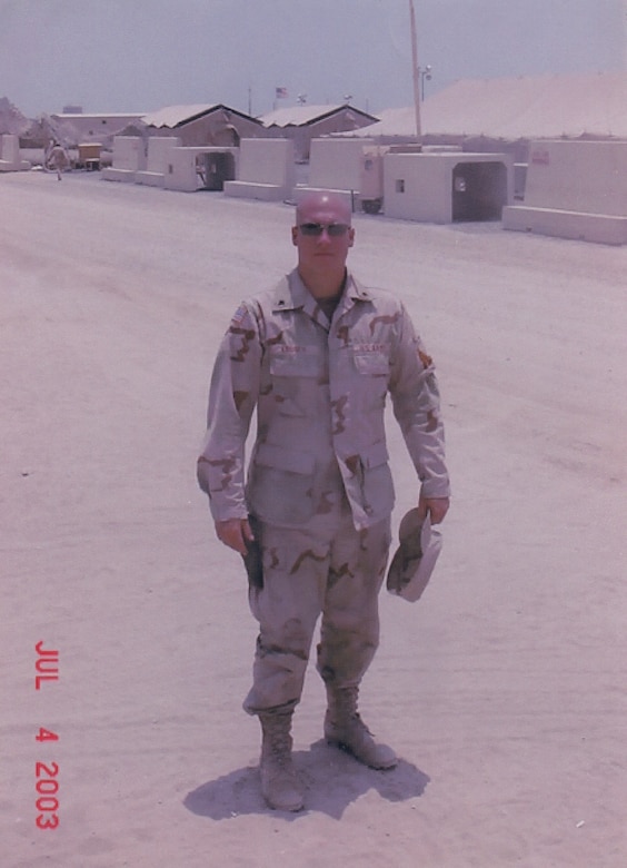 U.S. Army Reserve Staff Sgt. Eric Kroner pauses for a photo during a 2003 deployment. Kroner served with the 814th Military Police Brigade at Camp Bucca in Iraq during Operation Iraqi Freedom from 2003 to 2004.