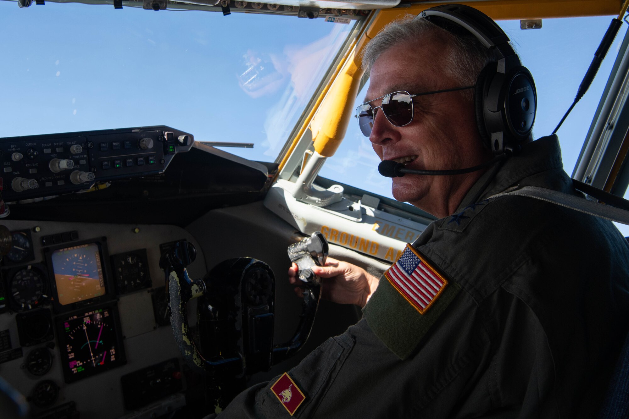 COMUSFJ poses for a picture while flying.