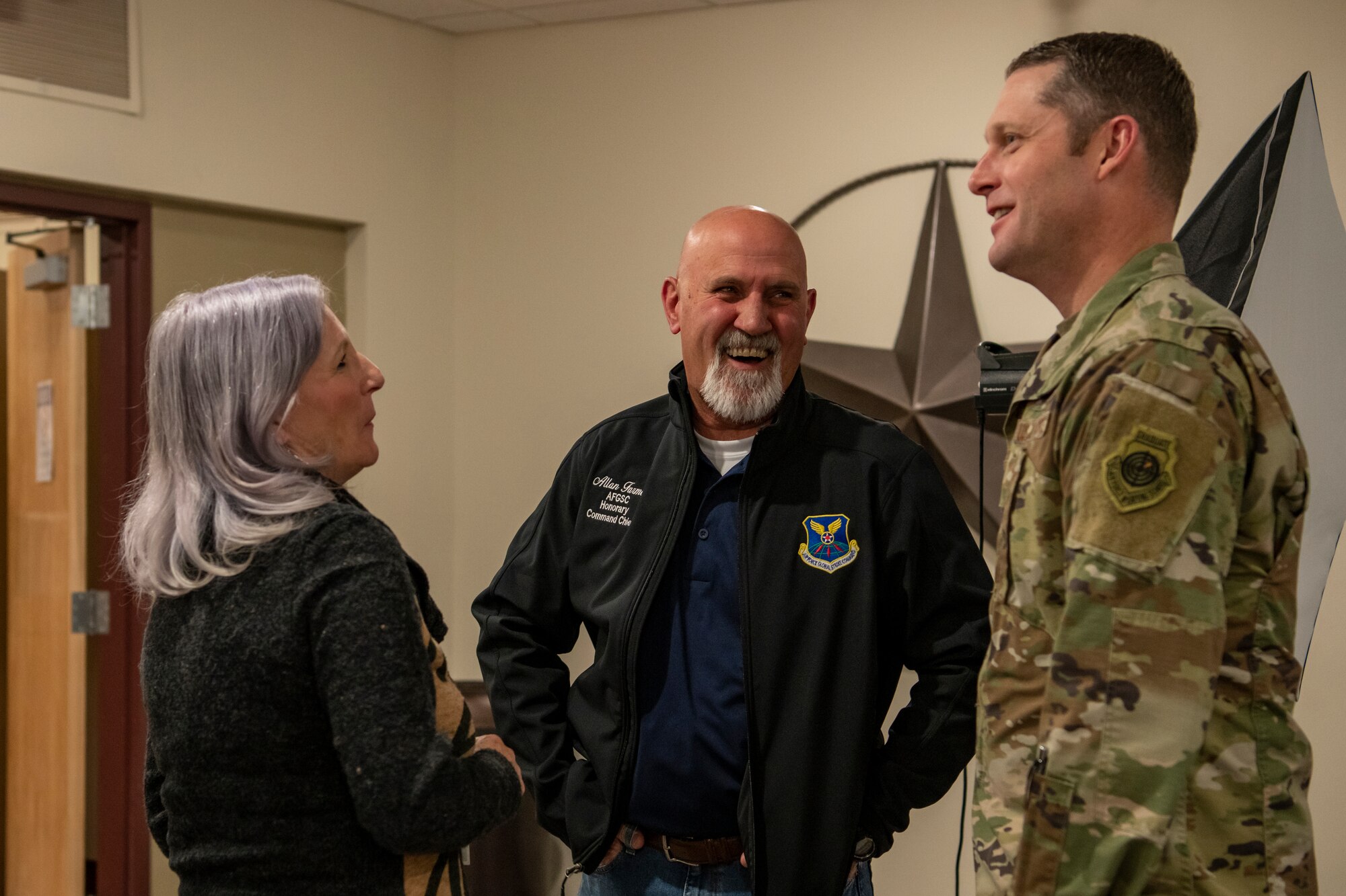 Judy Farmer, 7th Bomb Wing honorary commander, and Allan Farmer, Air Force Global Strike Command honorary command chief, speak with Col. Joseph Kramer, 7th BW commander, at an Honorary Commander Appreciation event at Dyess Air Force Base, Texas, Nov. 15, 2022. The event was held to inform honorary commander candidates about the program, as well as socialize them with their command counterparts. Civic and community leaders selected as honorary commanders will serve a two-year term. At the end of their term, the program’s goal is to have forged a mutually beneficial relationship between influential community members and Dyess Airmen that last beyond their term as honorary commanders. (U.S. Air Force photo by Senior Airman Mercedes Porter)