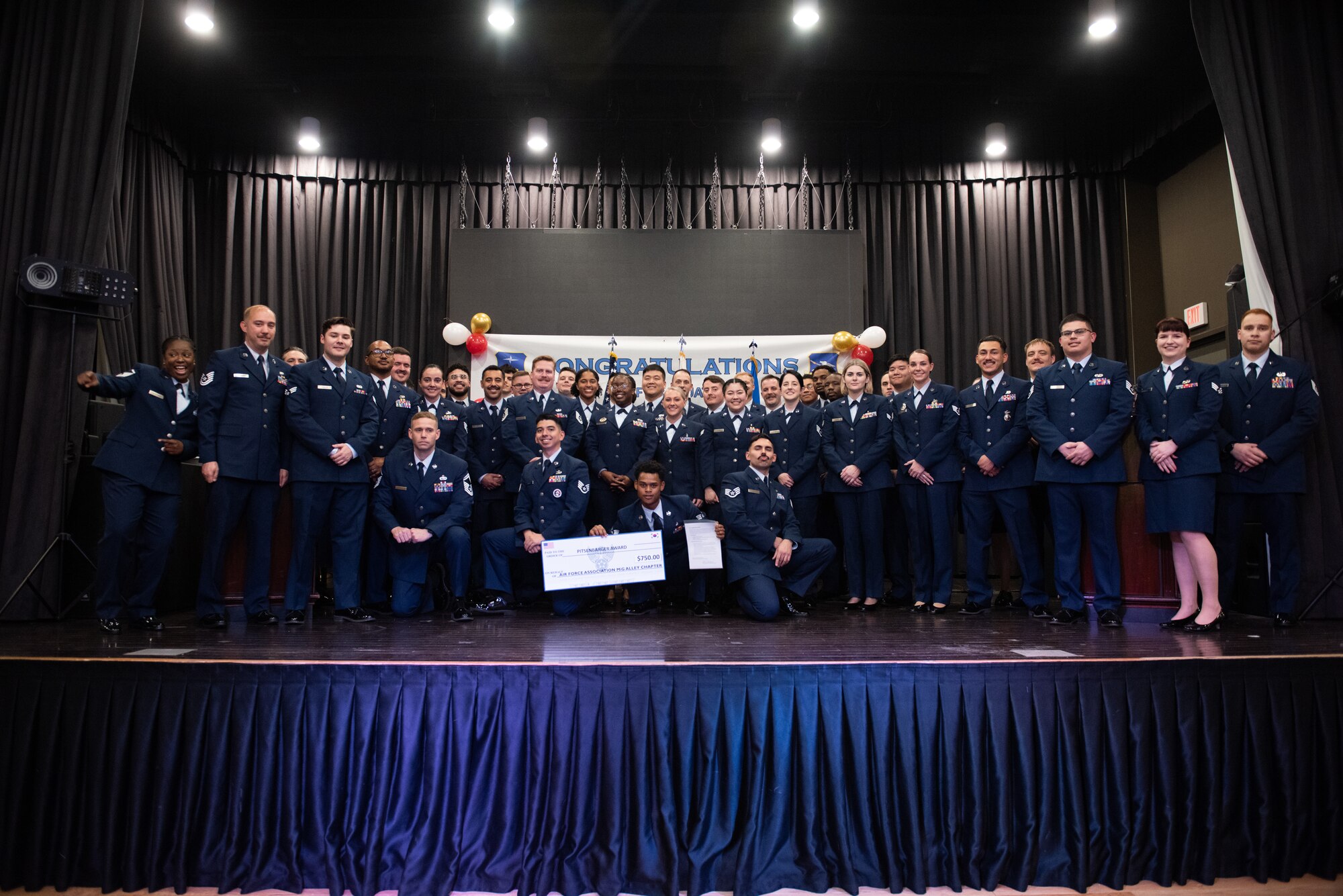 U.S. Air Force Airmen pose for a group photo after a Community College of the Air Force graduation ceremony at Osan Air Base, Republic of Korea, Nov. 15, 2022.