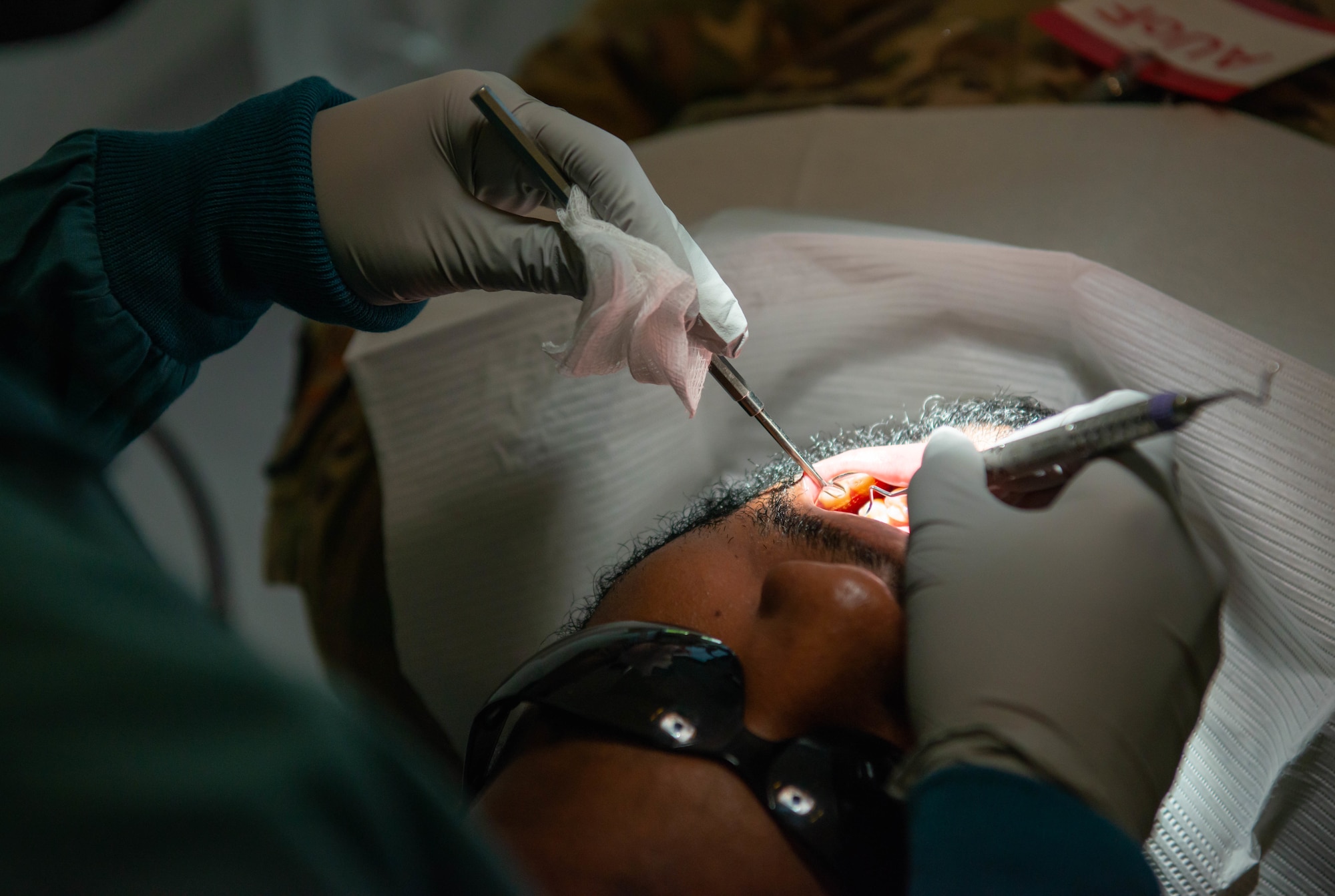 Dental technician performs cleaning