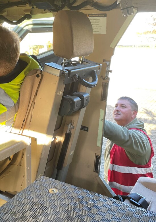 Joshua Calvert, who is currently working special duty as the Eygelshoven Army Prepositioned Stocks-2 worksite’s accountable officer, served in the Marine Corps in the mid ‘90s, then as a contractor at U.S. Army Yuma Proving Ground, Arizona, for 10 years, and now as an Army civilian with the 405th Army Field Support Brigade. Pictured here, Calvert and a quality control specialist inspect the current vehicle configuration on a recently received mine-resistant ambush protected-all terrain vehicle at the APS-2 site. (U.S. Army courtesy photo)