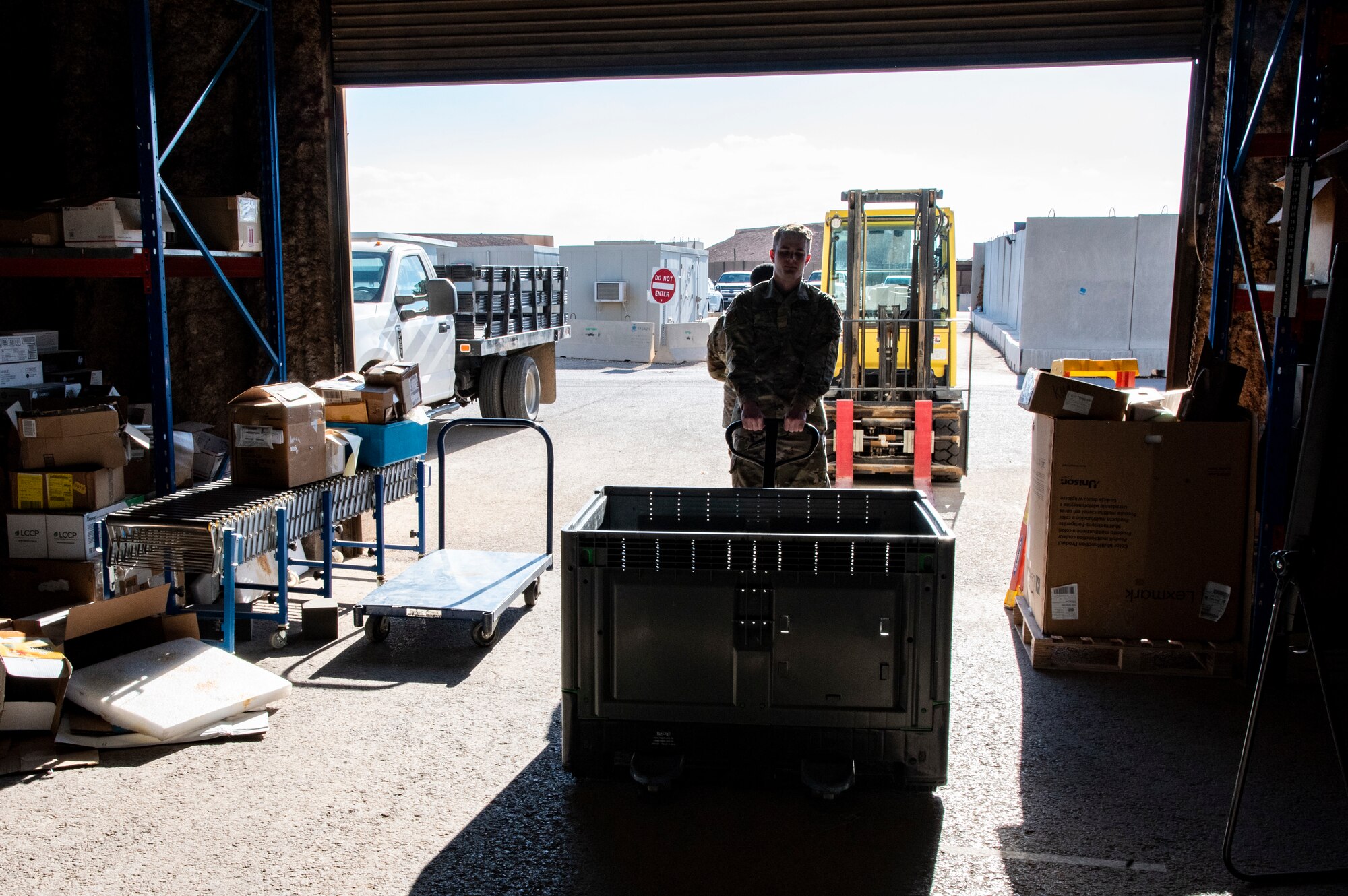 Airman 1st Class Jake Gaffney, 332d Expeditionary Logistics Readiness Squadron Individual Protective Equipment personnel, pulls a crate of ballistic plates for shipment at an undisclosed location, Southwest Asia, Nov. 11, 2022. These plates must be regularly shipped to testing facilities to ensure their structural integrity and continued effectiveness in body armor. (U.S. Air Force photo by: Tech. Sgt. Jim Bentley)