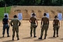 U.S. Sailors, assigned to USS John C. Stennis (CVN 74), draw M9 pistols during a qualification course at the Cheatham Annex gun range on Naval Weapons Station Cheatham Annex in Williamsburg, Virginia.