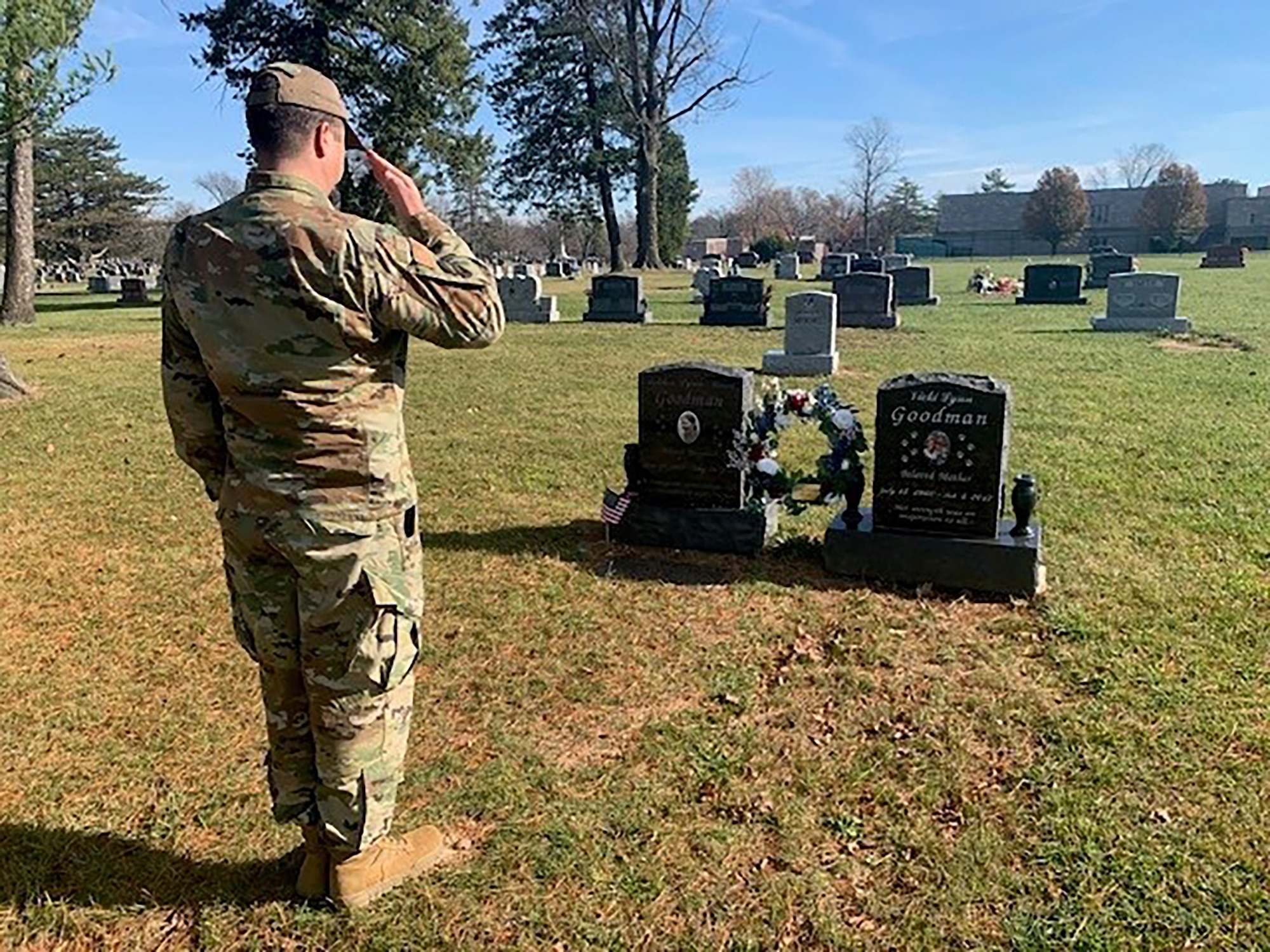 Master Sgt. Mark Reel, 445th Logistics Readiness Squadron logistics supply manager, salutes the grave of Senior Airman Ashton L. M. Goodman, who passed away May 26, 2009 while serving in Afghanistan. Reel and Senior Master Sgt. Douglas Schaumleffel, 445th LRS ground transportation NCO in charge, ere runners for the 2T1 Warrior Wreath Project. They brought their wreath to Goodman’s grave, located at Washington Park East Cemetery, Indianapolis, Indiana.