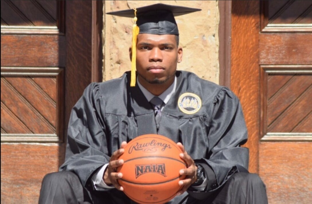 U.S. Marine Corps Capt. Richmond Jackson, an information system security manager for the Marine Corps Recruiting Command, poses for a photo during his graduation from at Frisk University, Nashville, Tenn., May 4, 2015. With no support on his education while growing up, Jackson defied all odds and created a successful career within the Marine Corps. (Courtesy photo by Avery Adams)